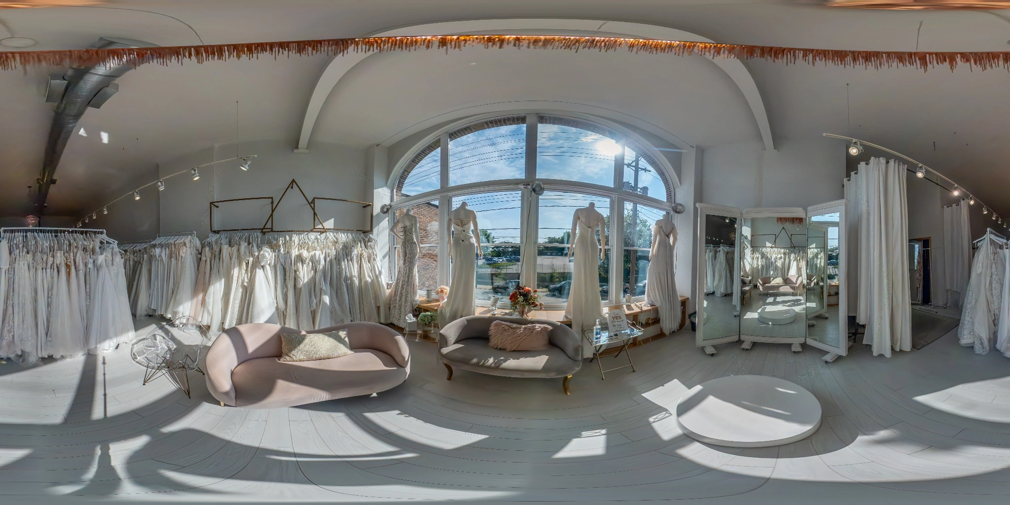360 degree panorama of a bright bridal retail showroom
